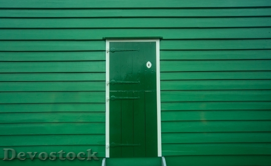 Devostock Green Door Wood Entrance 6336 4K.jpeg