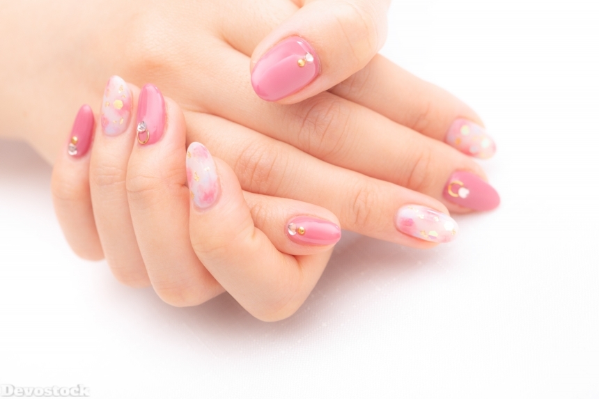 Devostock Girl hands Fingers Nail Arts Pink Color Holding 4k