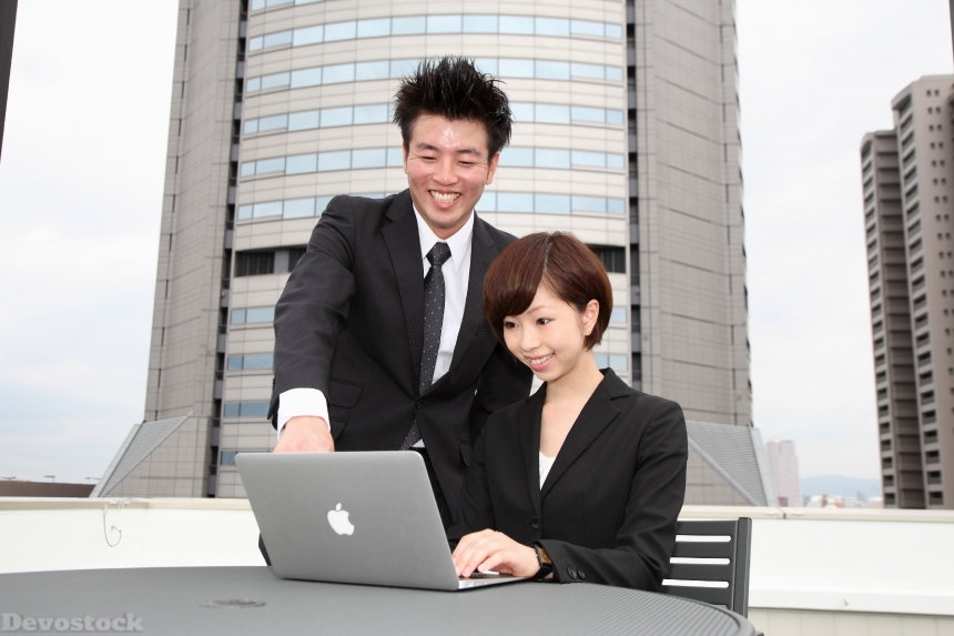 Devostock Woman Man Laptop Showing Employment Interview Business Office 4k