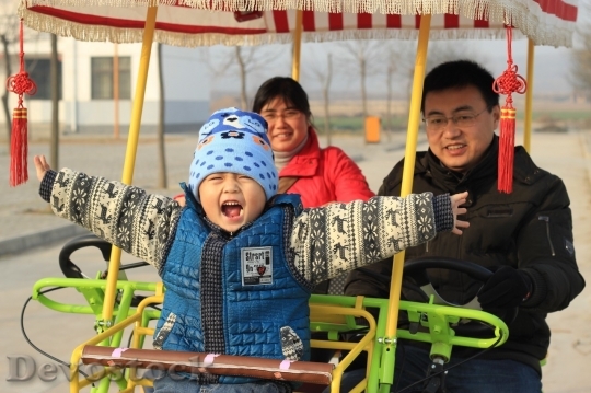 Devostock Asian Family and happy little boy