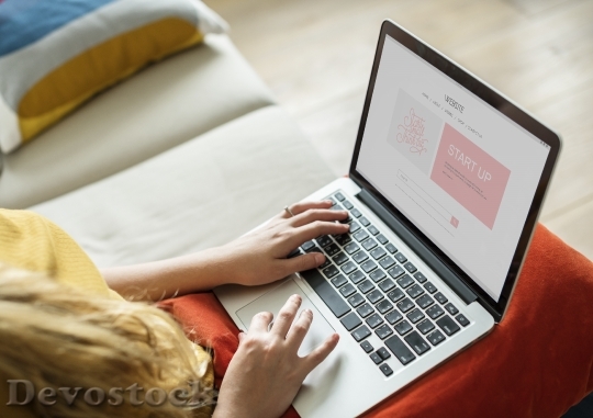 Devostock Caucasian woman using computer laptop