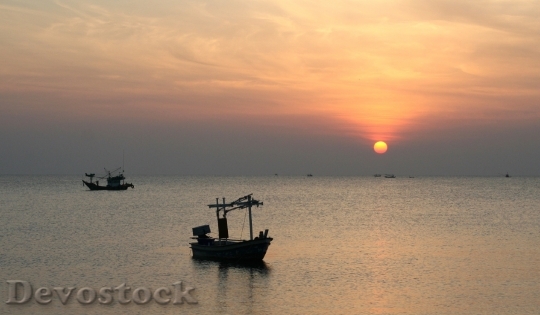 Devostock Peaceful Morning Boat Sunrise