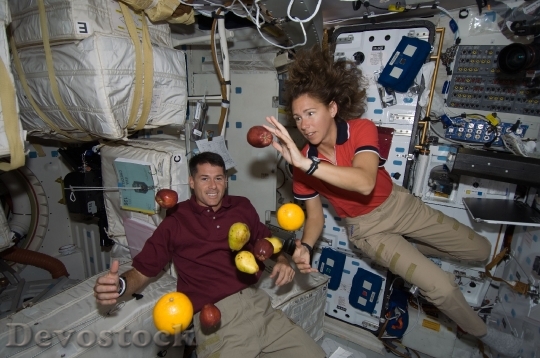 Devostock Astronauts Floating Fruit Space HD