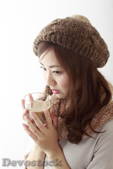 Devostock Beautiful Japanese woman Hat Winter Drinking Hot