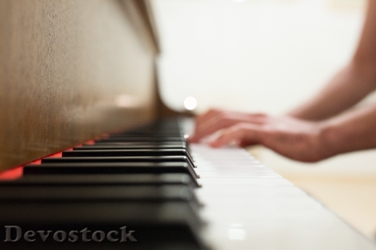 Devostock HAND PLAYING PIANO