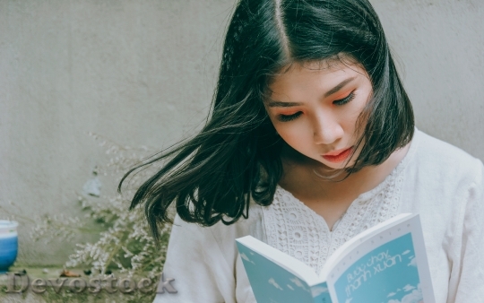 Devostock Vietnamese Girl Reading 4K