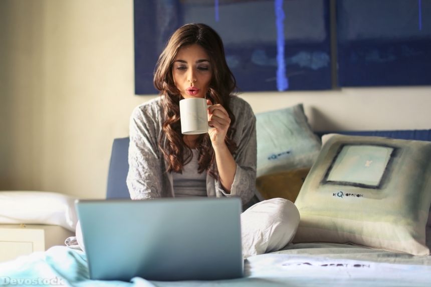 Devostock Beautiful Girl Bed Drinking Coffee Browsing Internet Laptop 4k