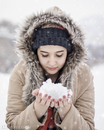 Devostock Charming Girl Holding Snow Cold Outdoor 4k