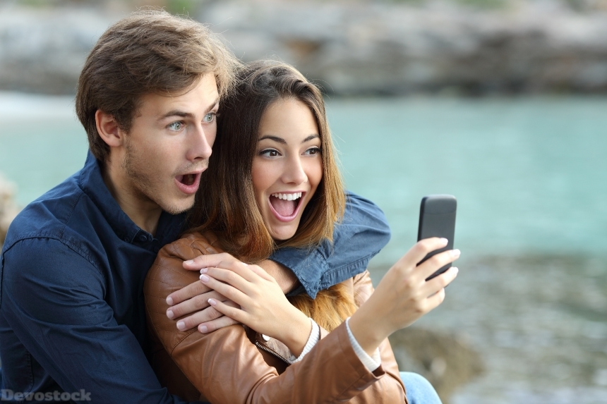 Devostock Couples Surprise Expression Emotion Smartphone Hands Girl Man Concept 4k