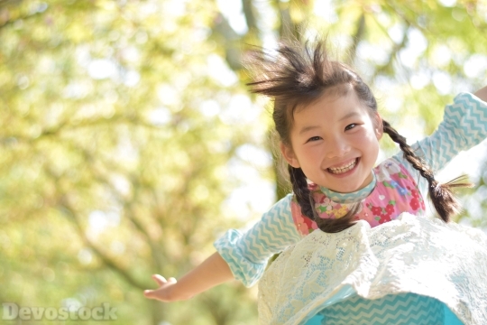 Devostock Jumping Happy Little Girl Nature 4k
