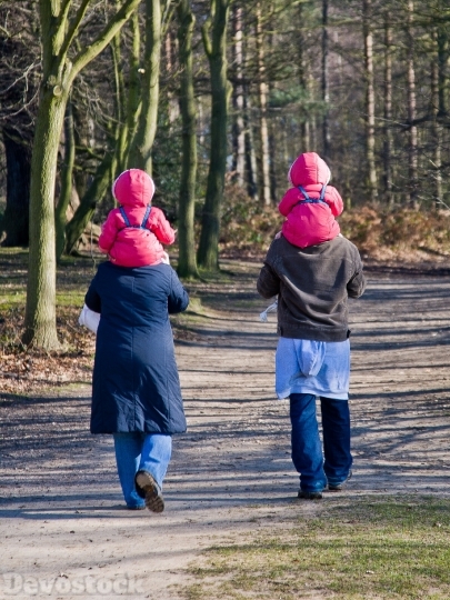 Devostock Twins Parents Walking Mother 4K