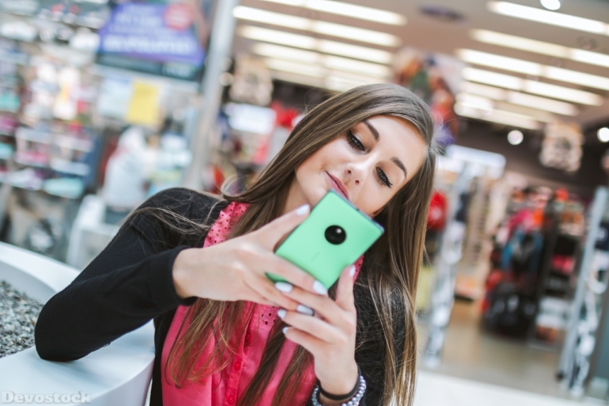 Devostock Western Girl Woman Smartphone Mobile Shopping Center Smiling 4k