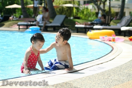 Devostock Asian boy and girl swimming