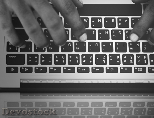 Devostock Businessman using computer laptop at work