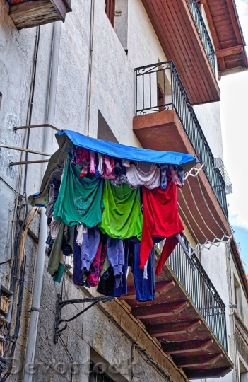 Devostock Clothes hanging from the balcony