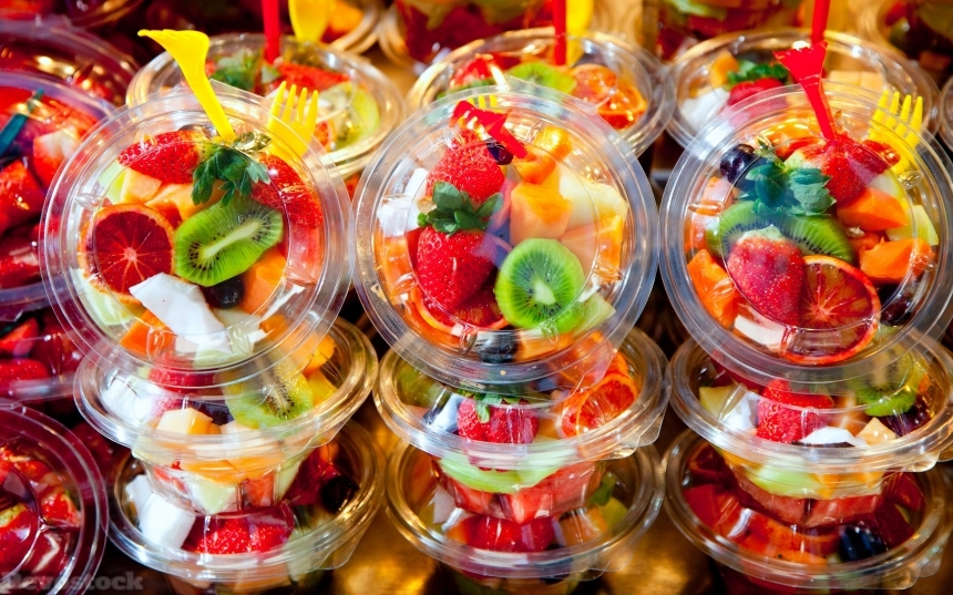 Devostock Colorful fruit salad in transparent glasses