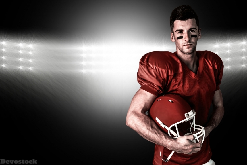 Devostock Composite image of portrait of rugby player posing with helmet
