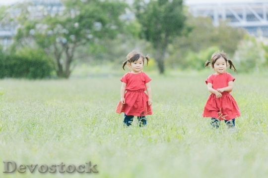 Devostock Cute little children twins
