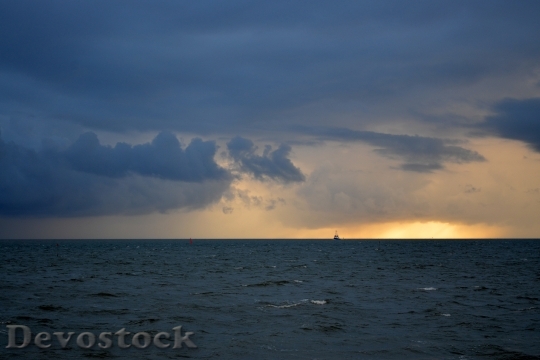 Devostock Clouds Sea Sunset Sky