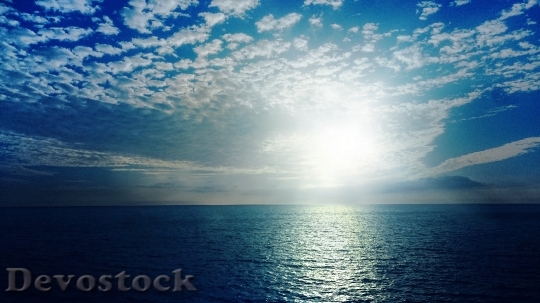 Devostock Ocean Landscape Sun Clouds