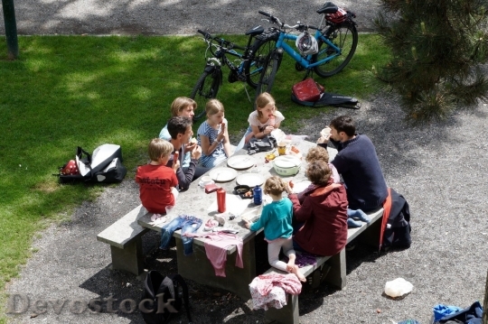 Devostock Family in the picnic eating food