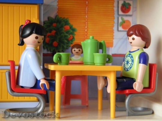 Devostock Lego boy and girl at the table