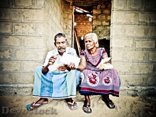 Devostock Wife and husband reading letter