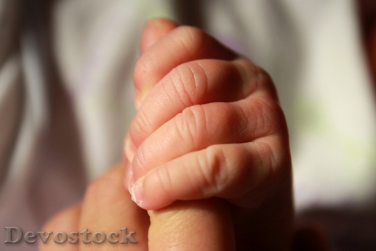 Devostock Baby Holding Hand Infant