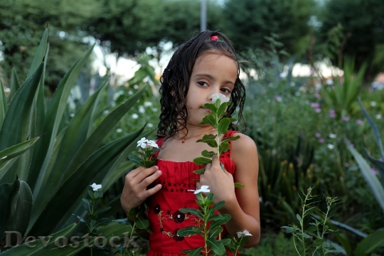 Devostock Girl Smelling Flower 1204303