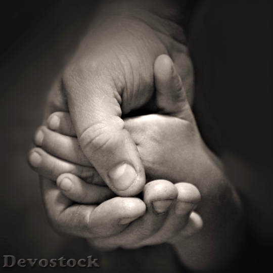 Devostock Hands Holding Dad Son