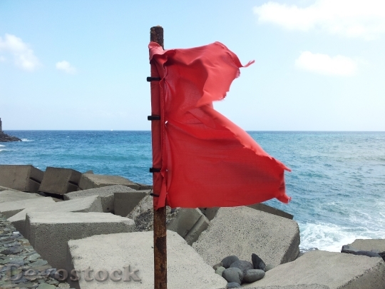 Devostock Red Flag Sea Wind