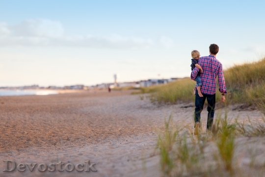 Devostock Walking Beach Family Together