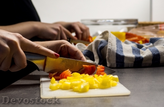 Devostock Woman Hands Cutting Vegetables