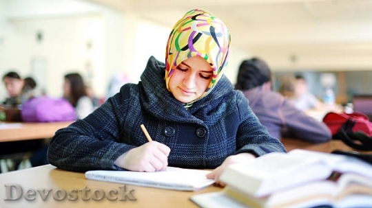 Devostock muslim-girl-studying-in-library-picture-id49279769$1