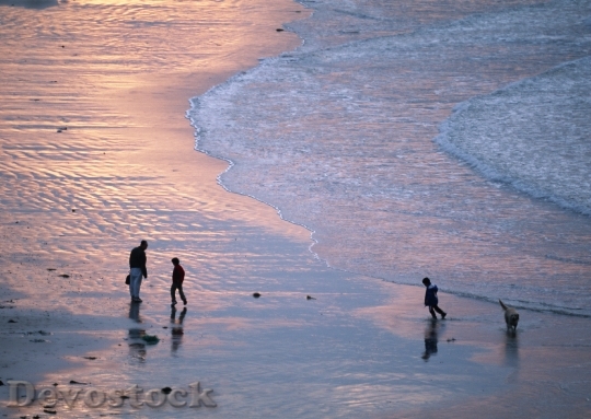 Devostock Family Walking Beach Sunset